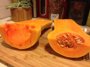 Halved squash; one intact, one gutted.